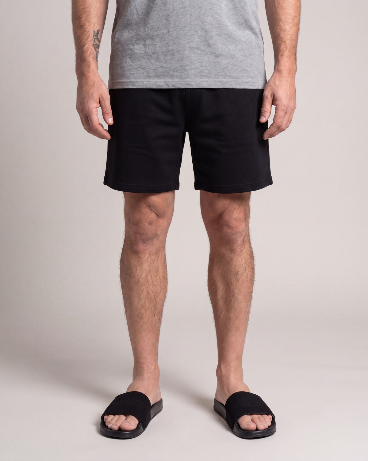 Primitive Collegiate Slides — Black — model front