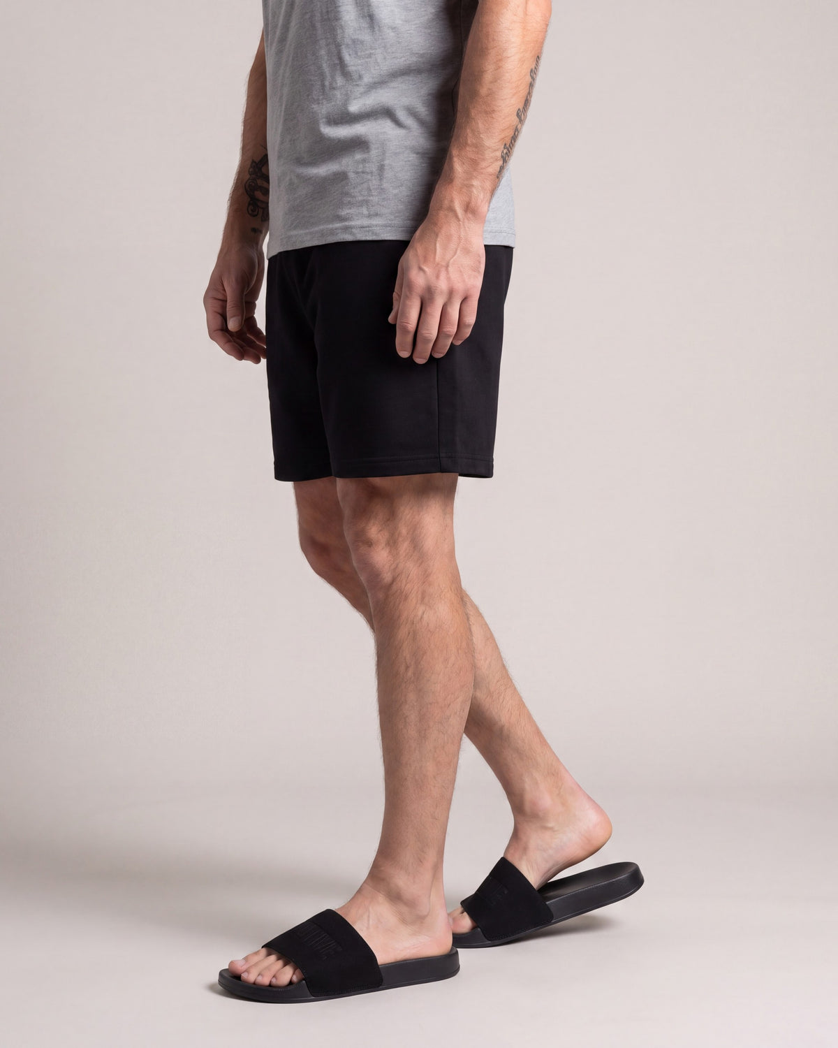 Primitive Collegiate Slides — Black — model side
