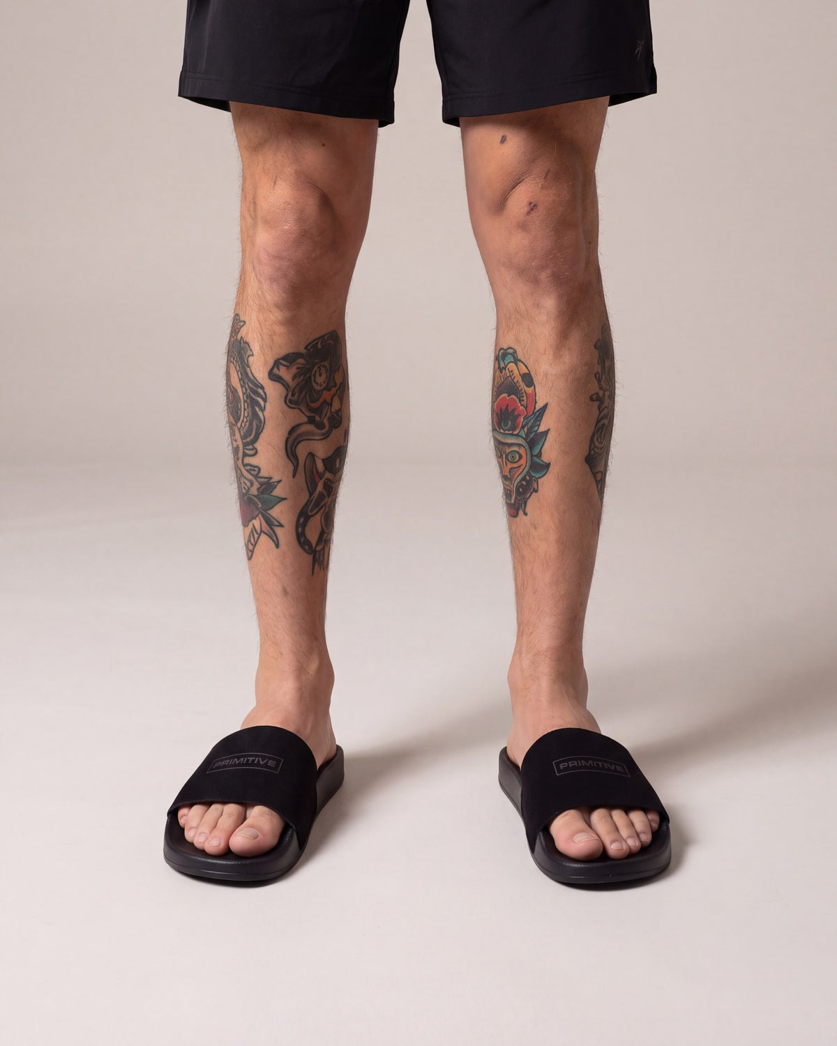 Primitive Suede Boxed Slides — Black — model front