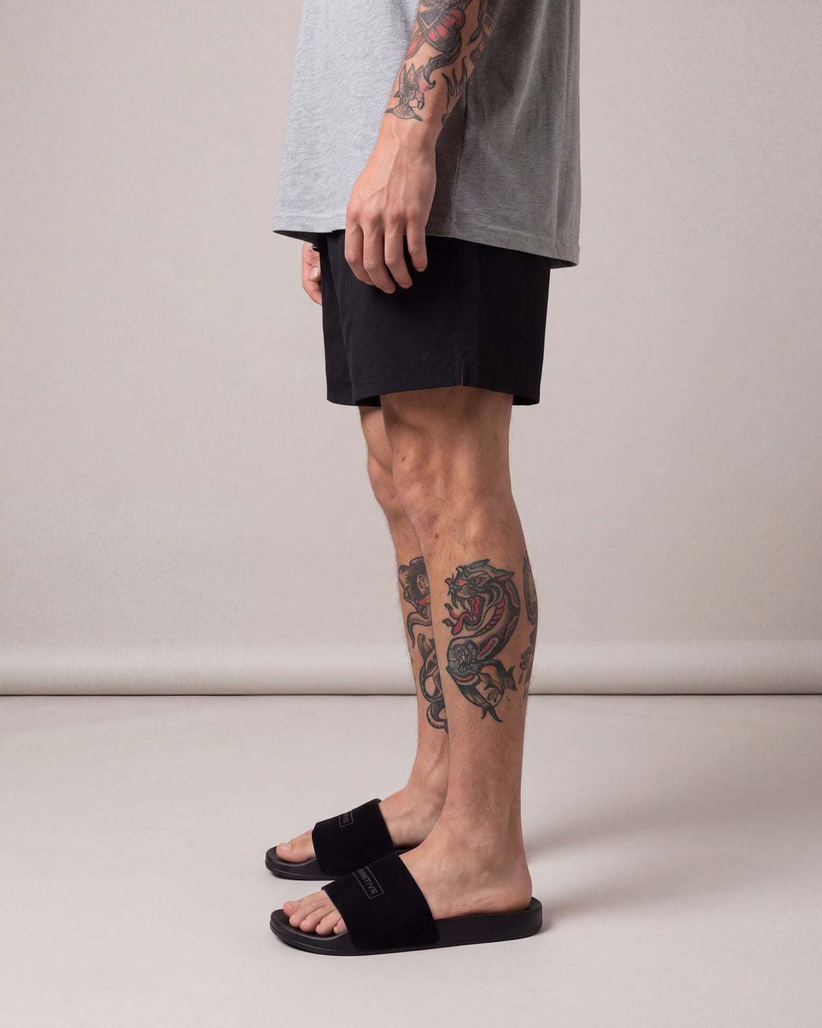 Primitive Suede Boxed Slides — Black — model side
