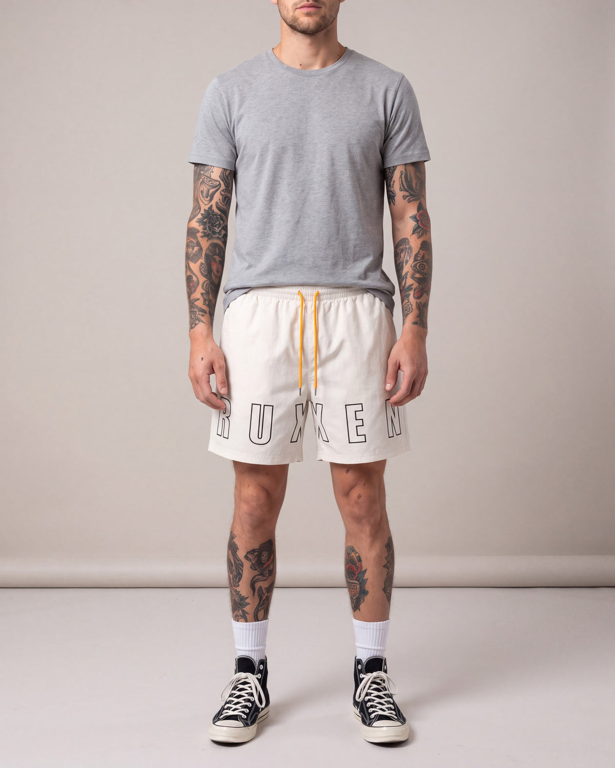 Ruxen Nylon Shorts — Off White — model front