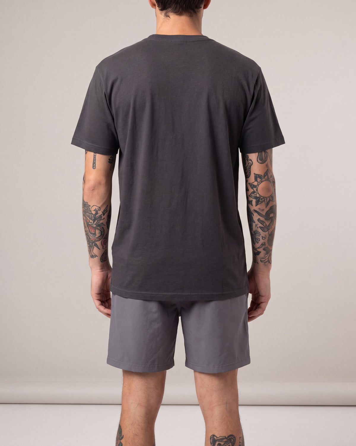 Grizzly Back Nine SS tees — Charcoal — model back